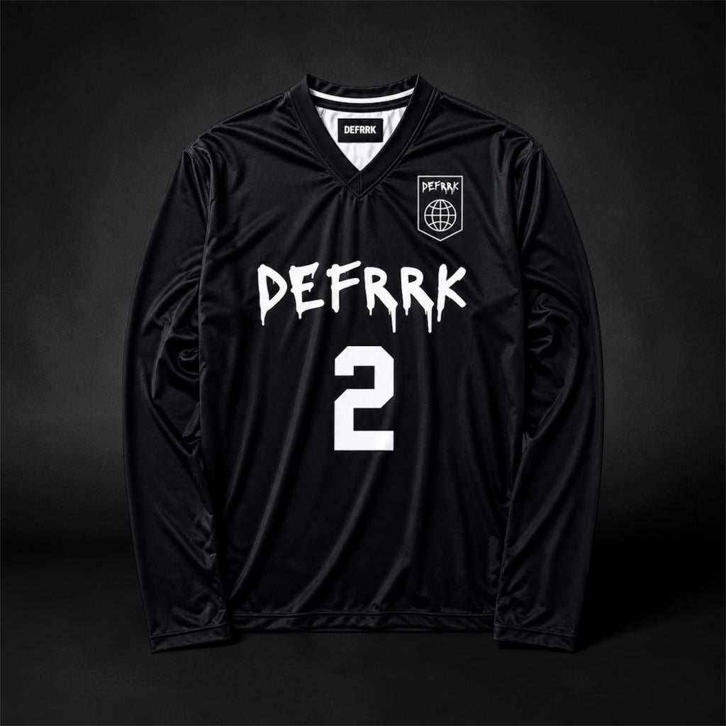 A black long-sleeve soccer jersey with 'DEFFRK' and the number '2' printed in white on the front, featuring a small crest on the left chest, displayed against a dark studio background.