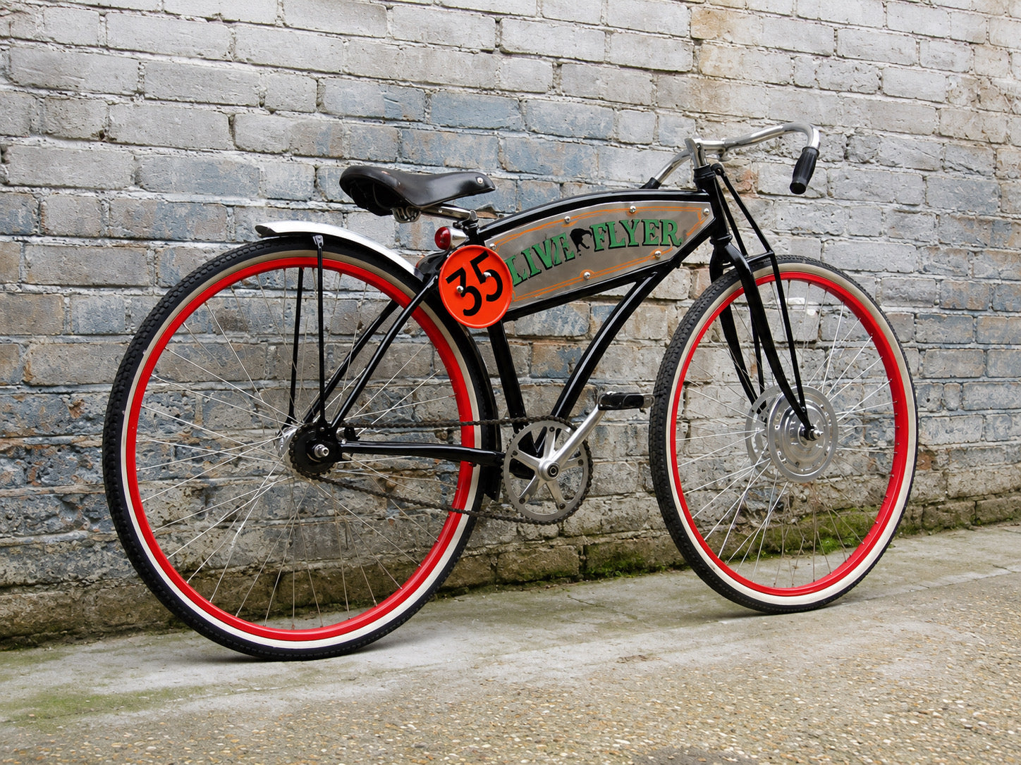 TRIFLEX Live Flyer 35 vintage bicycle with black frame, red and white wheels, chrome details, leather saddle, and number 35 plate against a weathered brick wall.  Product of Triflex Creative Studio. 